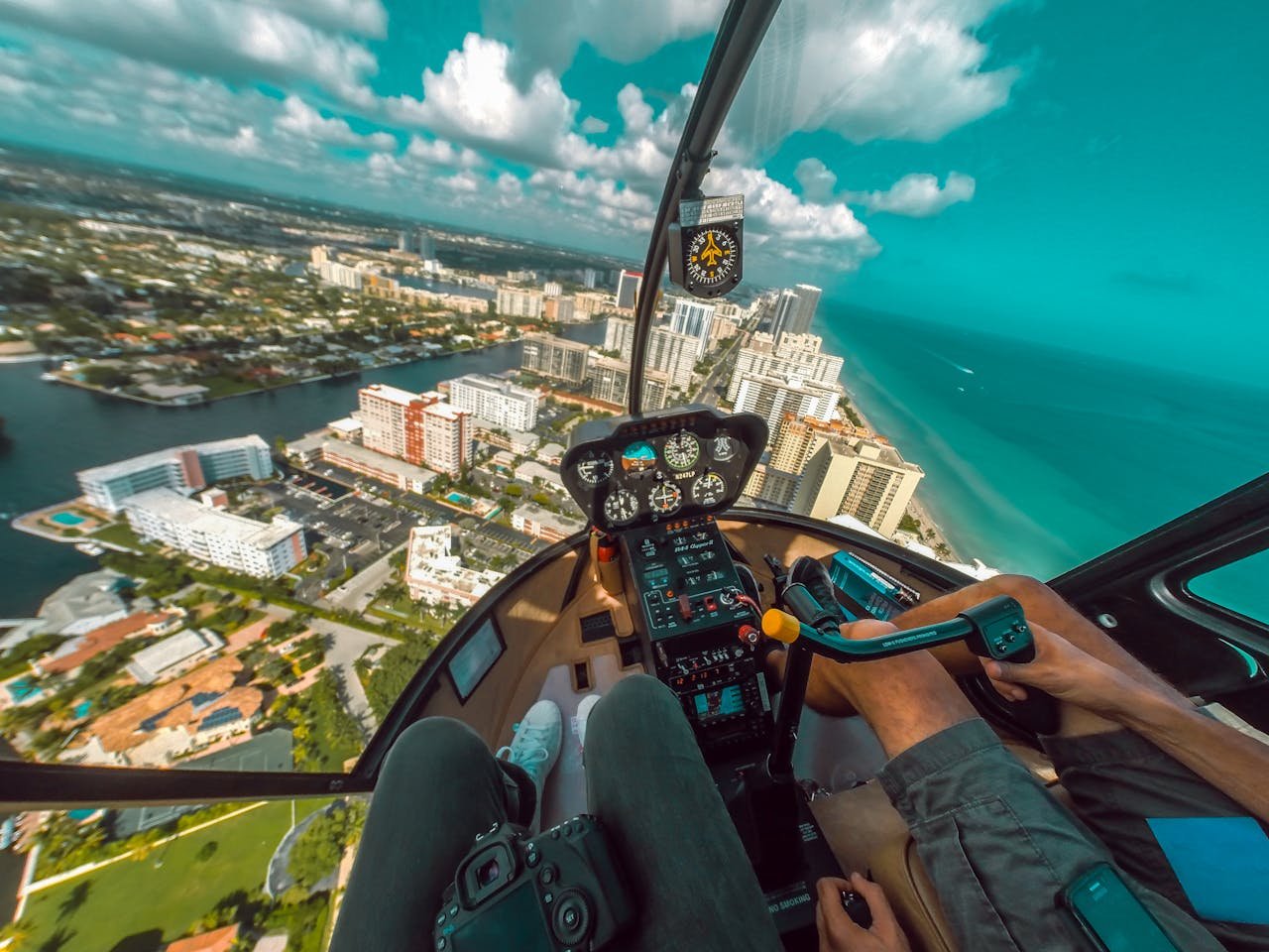 Experience the thrill of a helicopter ride over Miami Beach, capturing stunning aerial views of the skyline and ocean.